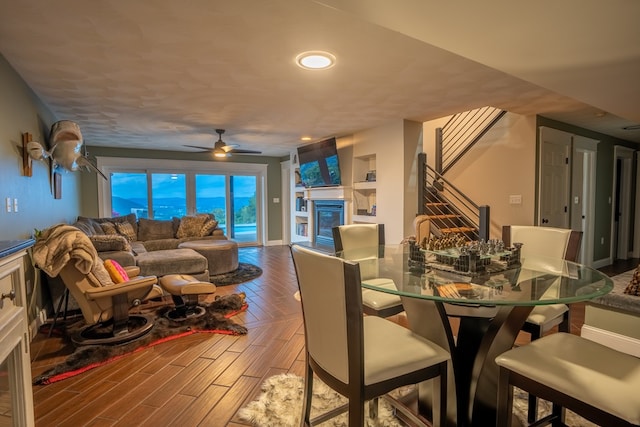 dining room with ceiling fan and hardwood / wood-style floors