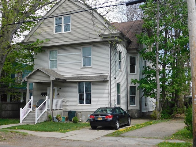 view of front of property with roof with shingles
