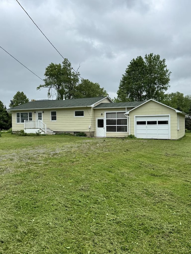 109 Main St, Roulette, PA 16746 - back of property featuring a yard and a detached garage