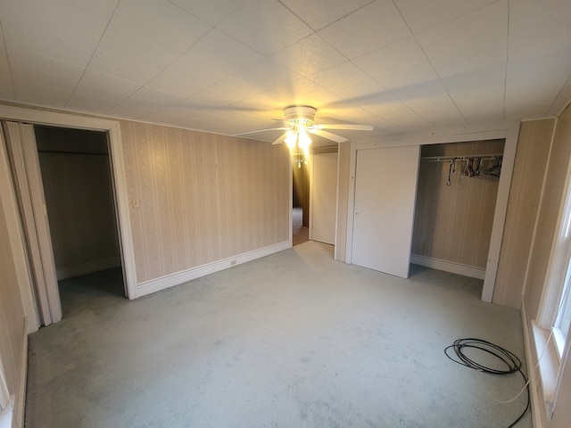 unfurnished bedroom with ceiling fan and light carpet