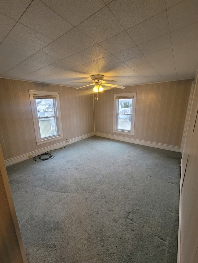 carpeted empty room with ceiling fan