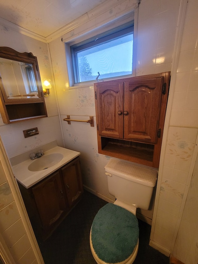 bathroom featuring crown molding, vanity, and toilet