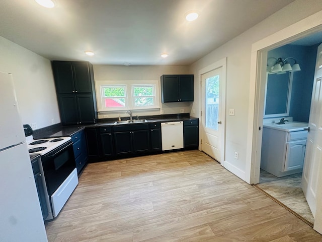 228 Willow St, Athens, PA 18810 - kitchen with white appliances, a sink, dark countertops, light wood-type flooring, and recessed lighting