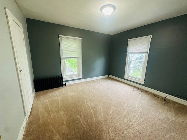 228 Willow St, Athens, PA 18810 - unfurnished bedroom featuring radiator, carpet flooring, and baseboards