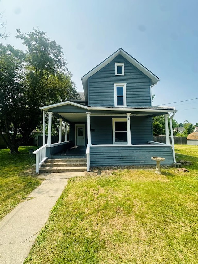228 Willow St, Athens, PA 18810 - farmhouse-style home featuring covered porch and a front lawn