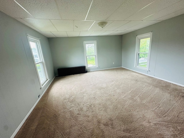 228 Willow St, Athens, PA 18810 - spare room with radiator, baseboards, a paneled ceiling, and carpet flooring