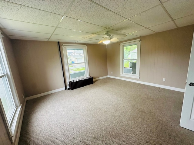 228 Willow St, Athens, PA 18810 - carpeted empty room featuring radiator, a paneled ceiling, plenty of natural light, and baseboards