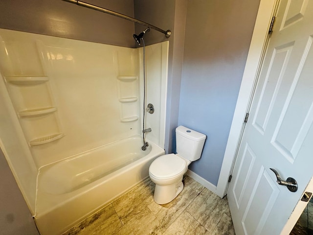 228 Willow St, Athens, PA 18810 - bathroom with toilet, baseboards, and bathtub / shower combination
