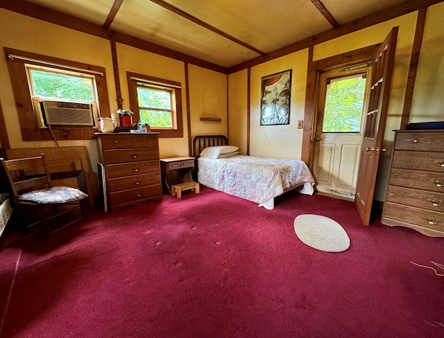 bedroom with dark colored carpet and cooling unit