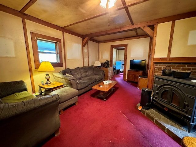 carpeted living room featuring a wood stove