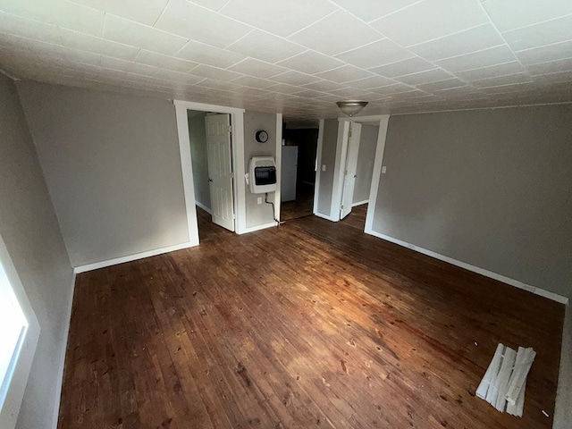 321/2 Pine St, Waverly, NY 14892 - unfurnished room with heating unit, dark wood-type flooring, and baseboards