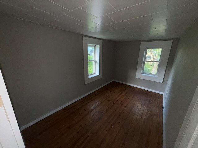 321/2 Pine St, Waverly, NY 14892 - unfurnished room with dark wood-type flooring, plenty of natural light, and baseboards