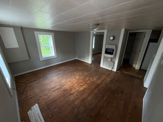 321/2 Pine St, Waverly, NY 14892 - unfurnished living room featuring heating unit, dark wood finished floors, and baseboards