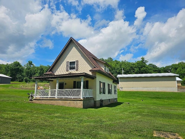 40 W Hebron Rd, Coudersport, PA 16915 - back of property with a porch and a yard
