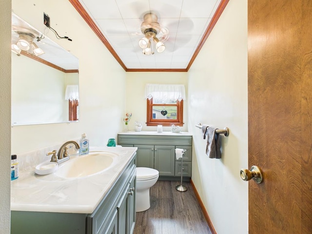 40 W Hebron Rd, Coudersport, PA 16915 - bathroom with ornamental molding, vanity, wood finished floors, and a ceiling fan