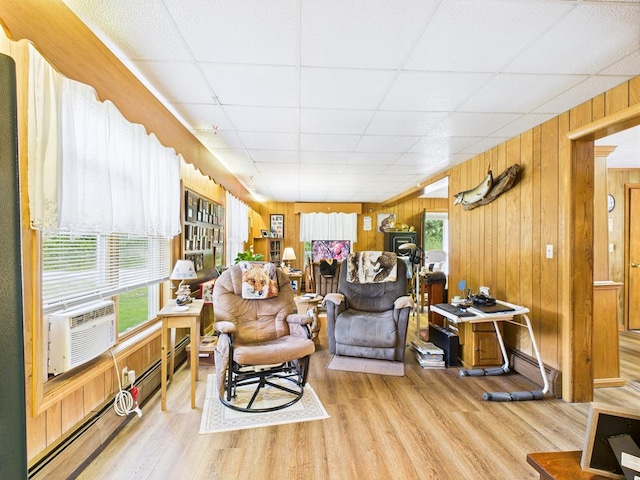 40 W Hebron Rd, Coudersport, PA 16915 - living room with wood walls, wood finished floors, a drop ceiling, and cooling unit