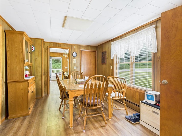 40 W Hebron Rd, Coudersport, PA 16915 - dining area with light wood-type flooring and wooden walls
