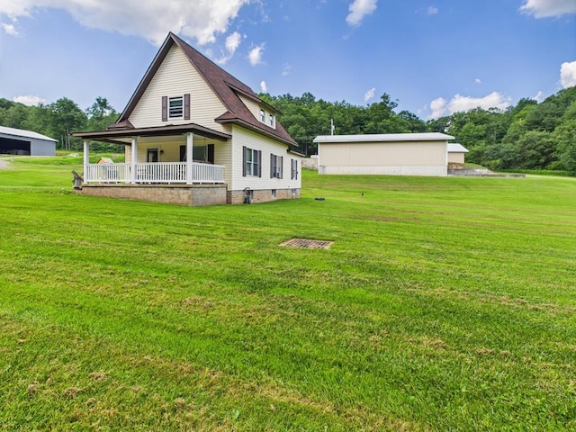 40 W Hebron Rd, Coudersport, PA 16915 - back of house with a porch and a lawn