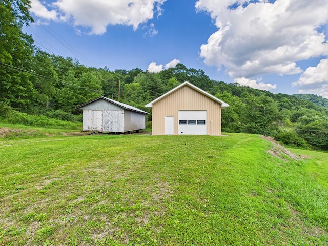 40 W Hebron Rd, Coudersport, PA 16915 - detached garage with a view of trees