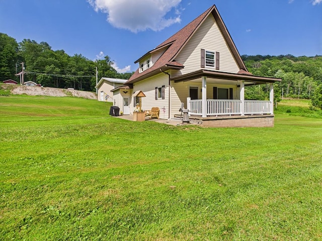 40 W Hebron Rd, Coudersport, PA 16915 - back of property with a lawn, covered porch, and a patio