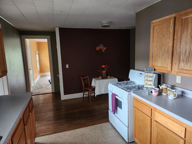 kitchen featuring light hardwood / wood-style floors and white range with gas stovetop