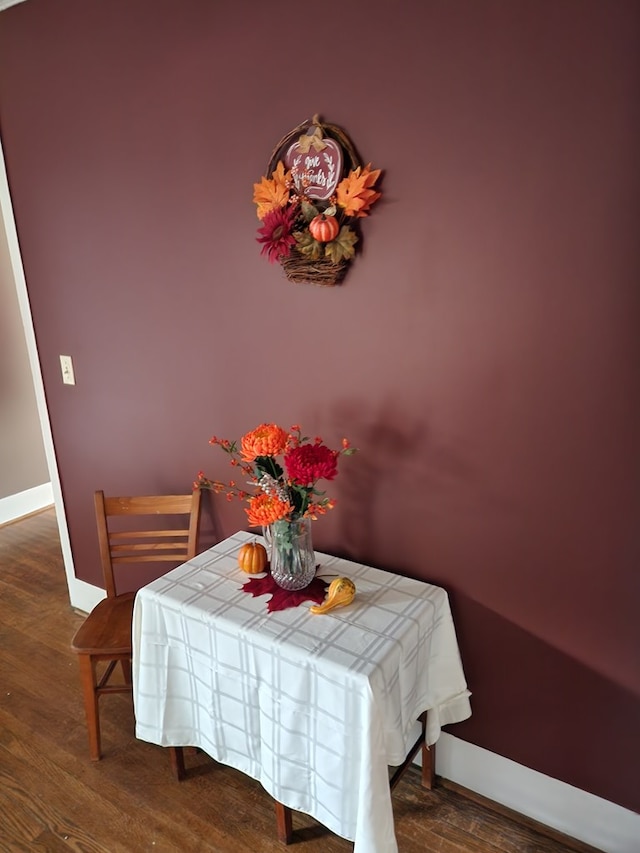 dining area with dark wood-type flooring