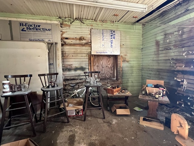 miscellaneous room with wood walls