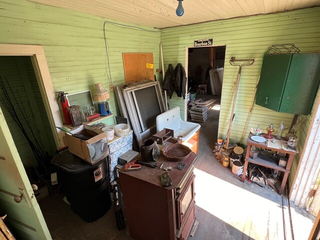 misc room with wooden walls and wood ceiling