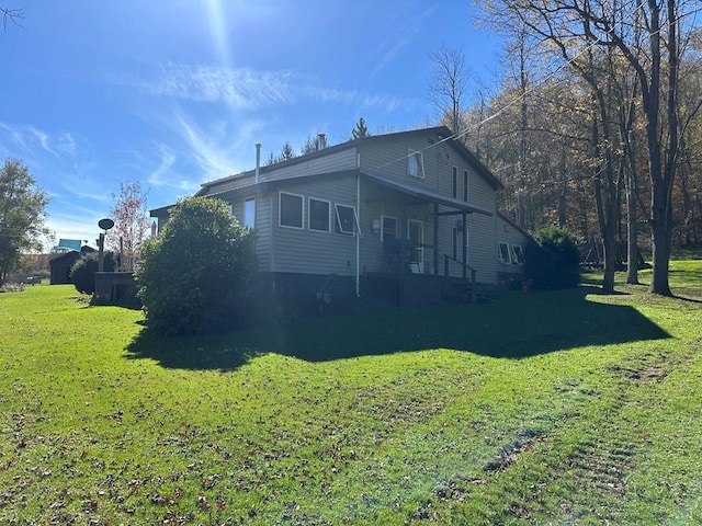 view of home's exterior with a lawn