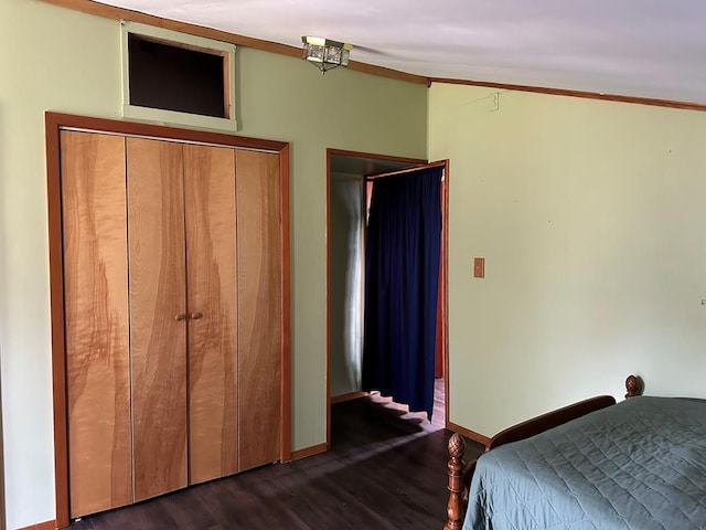 unfurnished bedroom featuring a closet and dark hardwood / wood-style floors