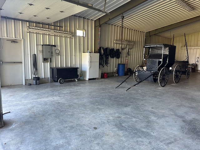 garage featuring white fridge