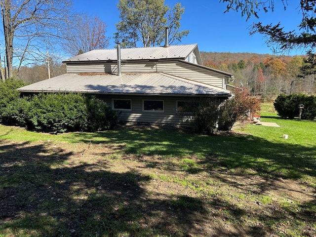 view of home's exterior featuring a yard