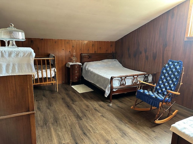 bedroom with dark hardwood / wood-style flooring