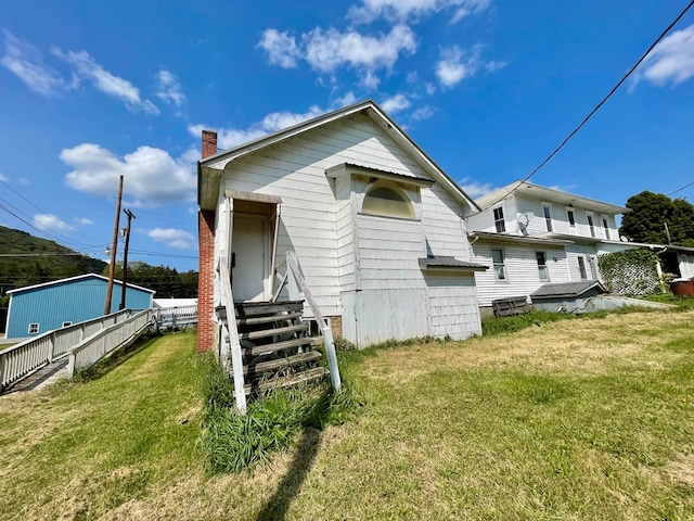 back of house with a yard