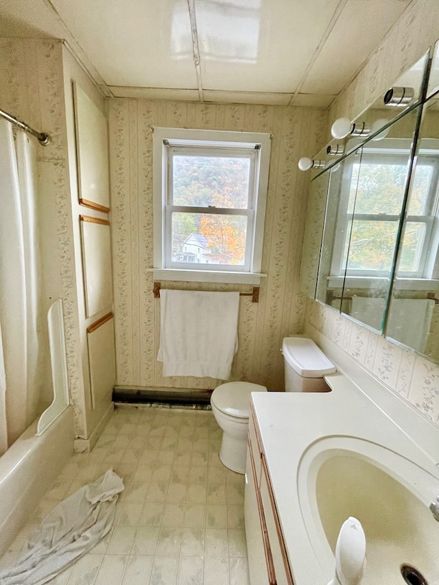 full bathroom with vanity, shower / bath combination with curtain, and toilet