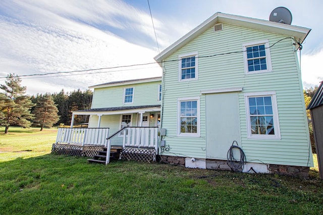 back of house with a yard