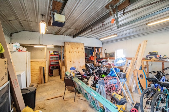 interior space with white fridge and a garage door opener