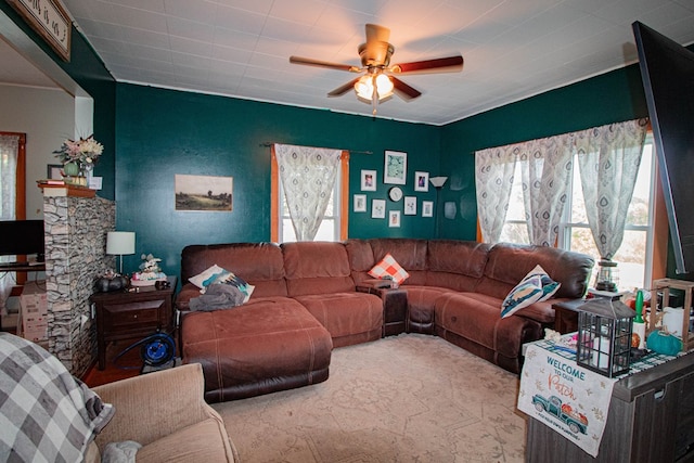 living room with ceiling fan and a healthy amount of sunlight