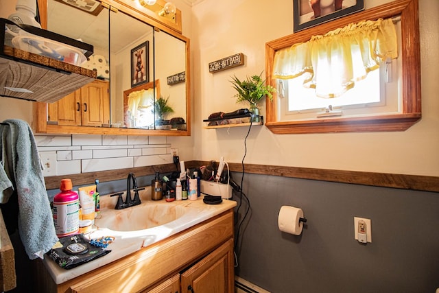 bathroom with decorative backsplash and vanity