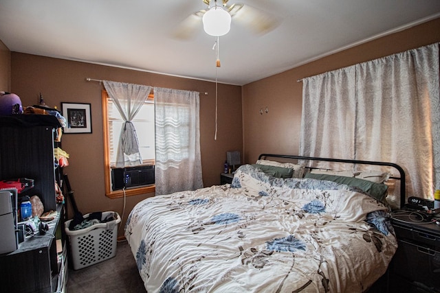 bedroom with carpet flooring, ceiling fan, and cooling unit