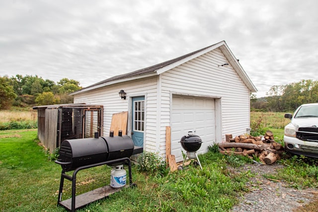 view of property exterior featuring an outbuilding and a garage