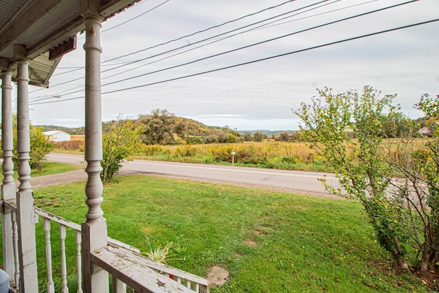 view of yard with covered porch