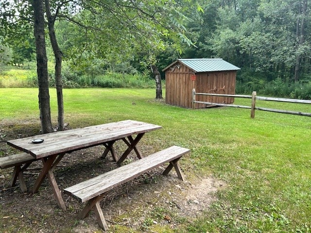 exterior space with a yard and a storage shed