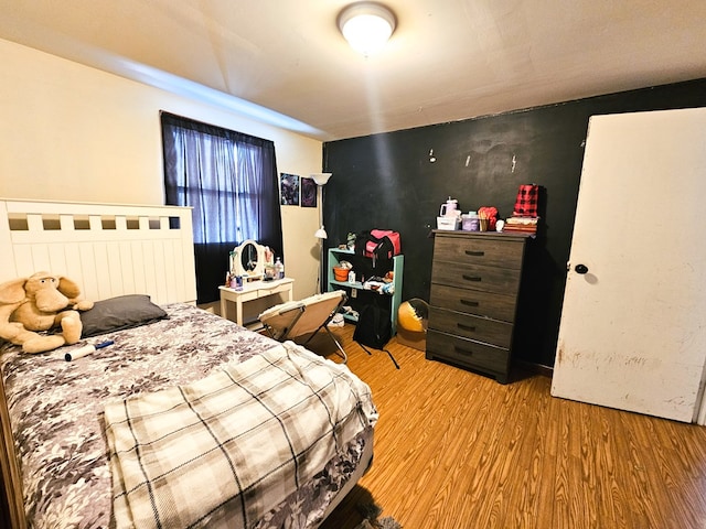 bedroom featuring light wood-style flooring