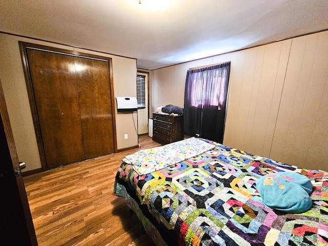 bedroom with a closet and wood finished floors