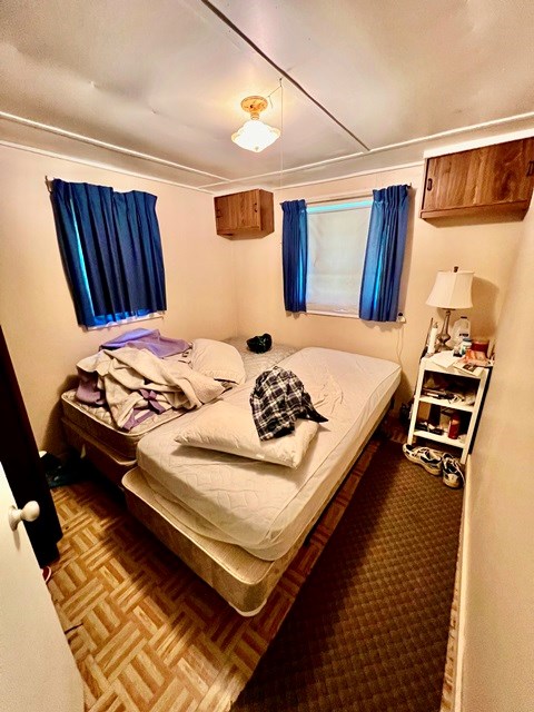 bedroom with parquet floors