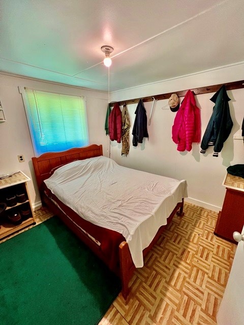 bedroom with parquet floors and billiards