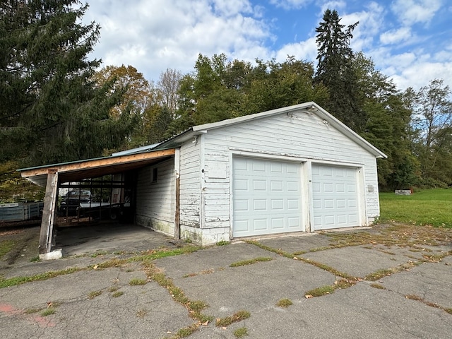 garage featuring a carport