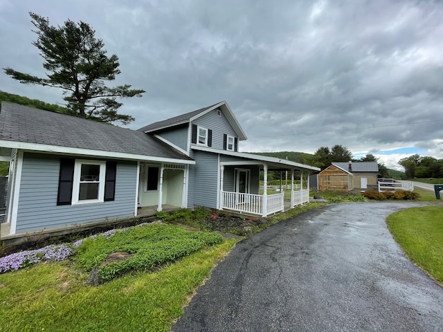 1571 State Route 44n, Coudersport, PA 16915 - view of front of home with covered porch and asphalt driveway