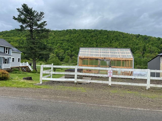 1571 State Route 44n, Coudersport, PA 16915 - view of front of property featuring a view of trees, an exterior structure, and an outdoor structure